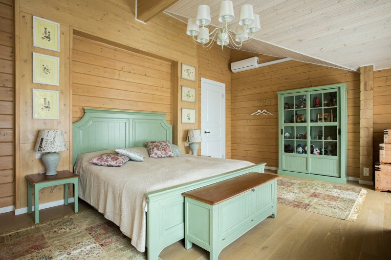 Log in the interior of the country house bedroom