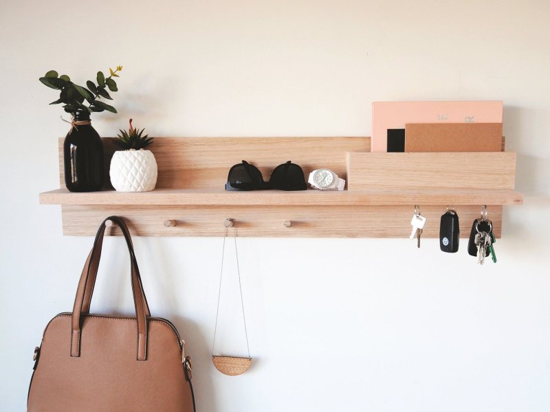 Wooden shelf with hooks