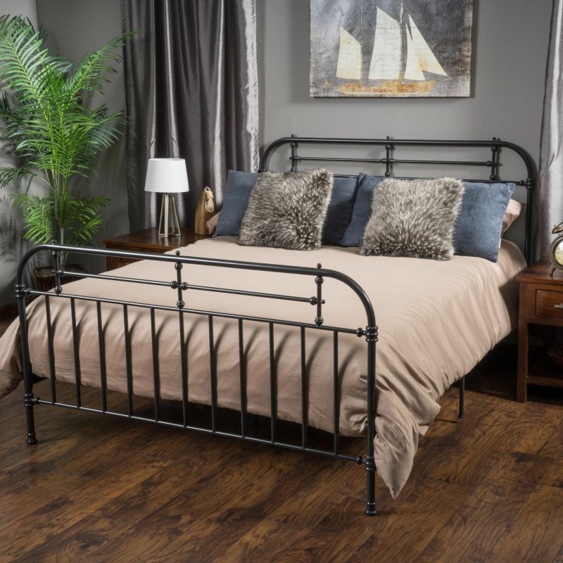 Metal bed in the interior of the bedroom