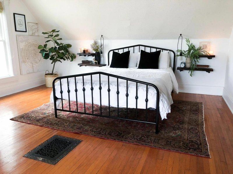 Metal bed in the interior of the bedroom