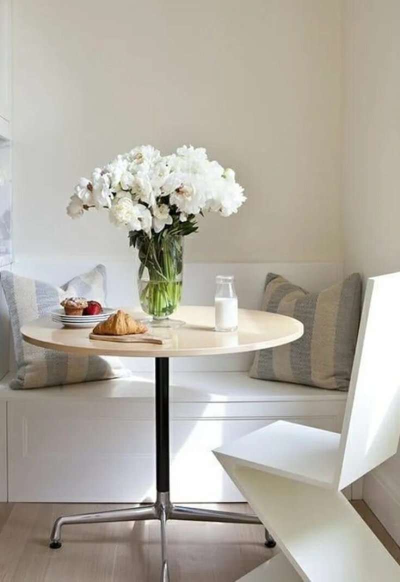 Round table in the interior of a small kitchen