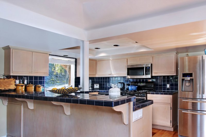 Kitchen design with a large refrigerator