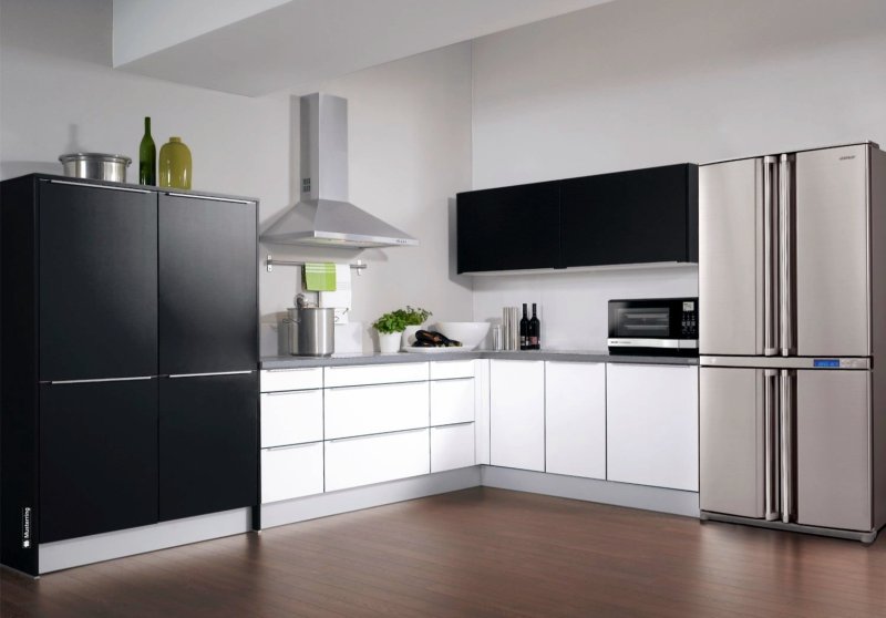 White kitchen with a black refrigerator