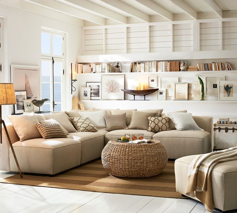 Beige sofa in the interior of the living room