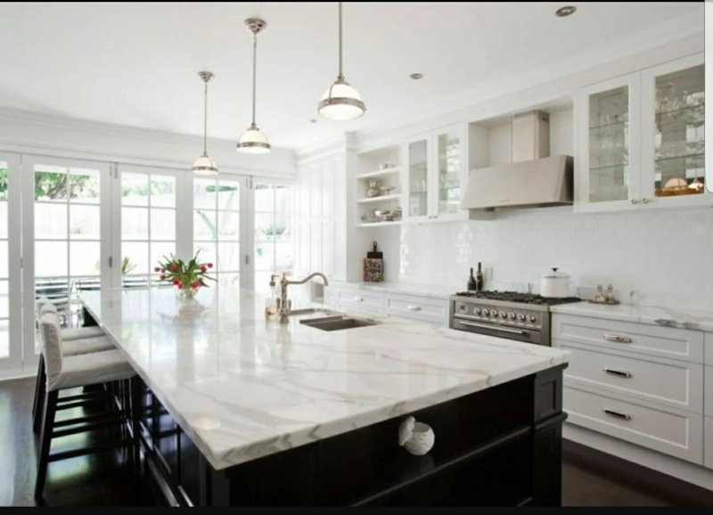 White kitchen with a marble tabletop