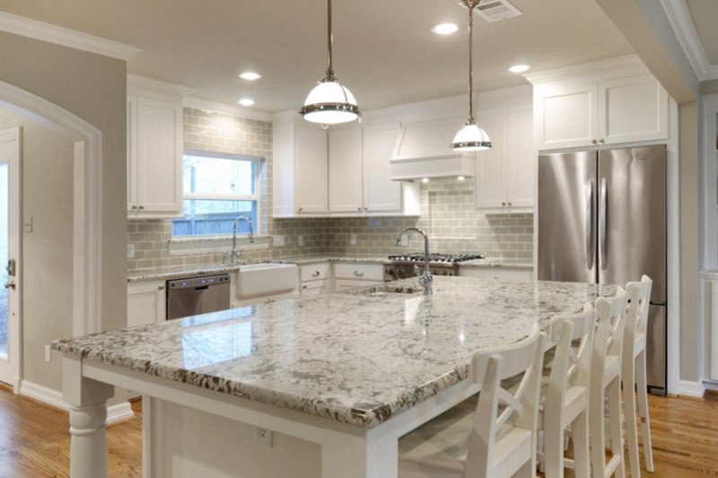 White kitchen with a marble tabletop