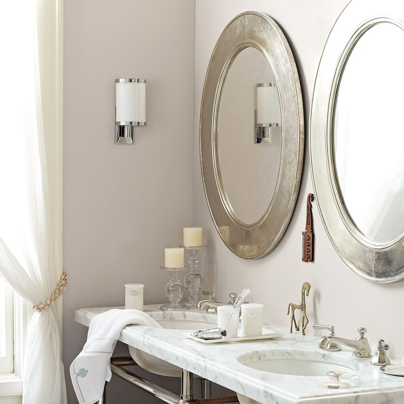 Round mirror in the bathroom in the interior