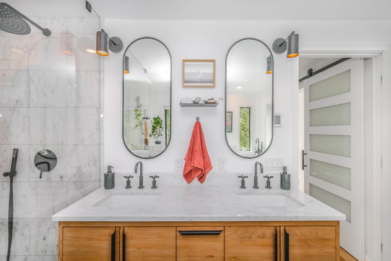 Round mirror over the sink