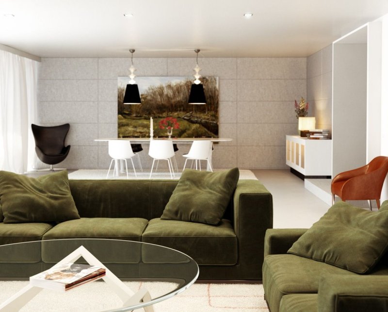 Green sofas in the interior of the living room