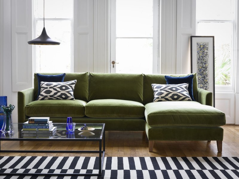 Green sofas in the interior of the living room