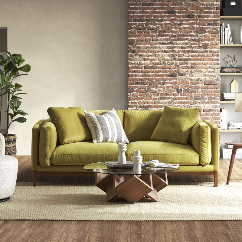 Green sofas in the interior of the living room