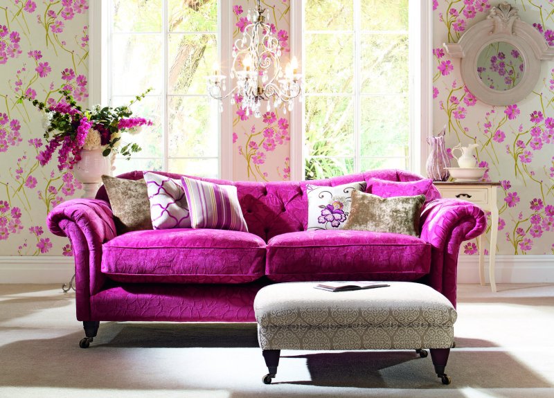 Violet sofa in the interior in the living room