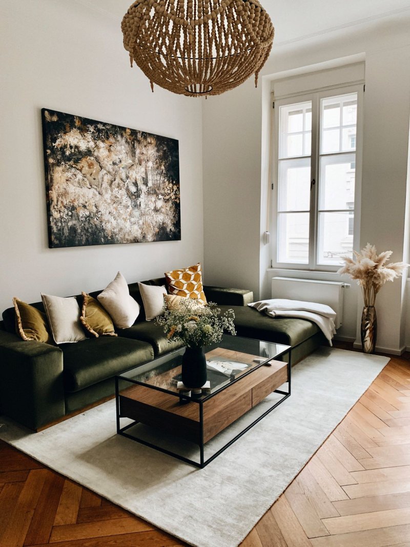 Green sofa in the Scandinavian interior