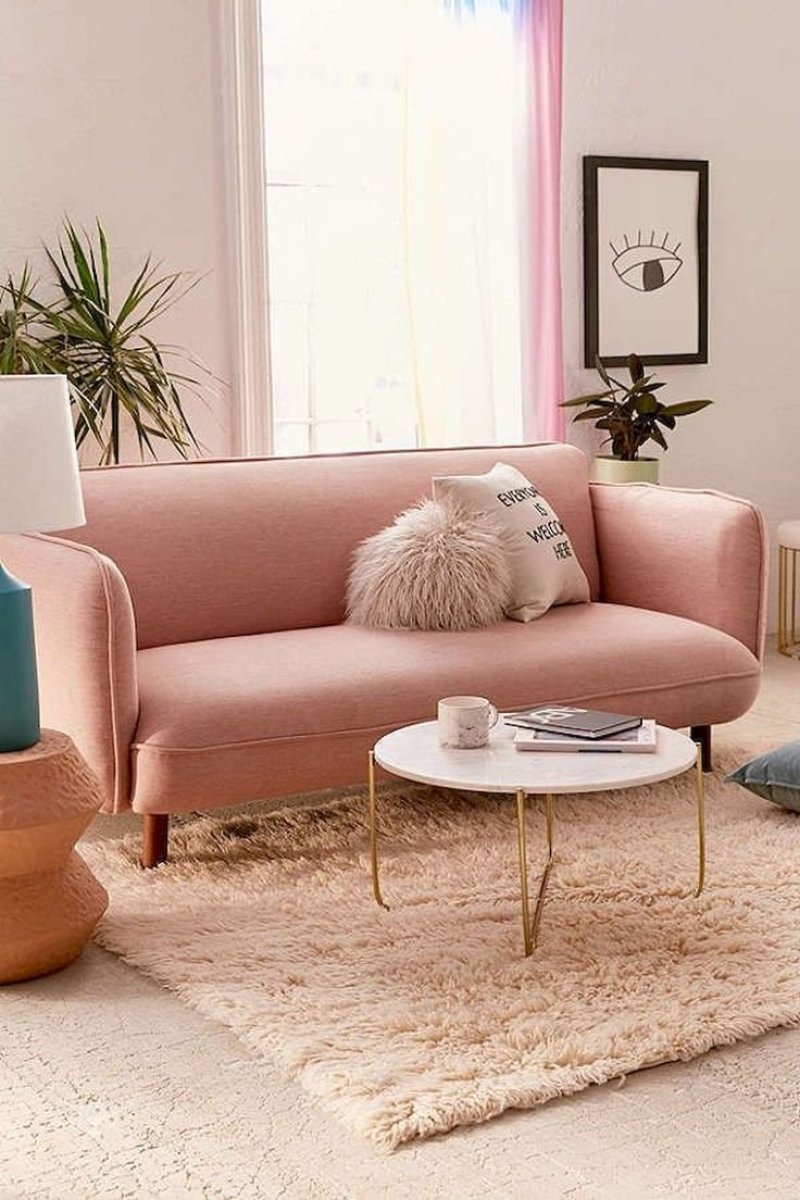 Pink sofa in the interior of the living room