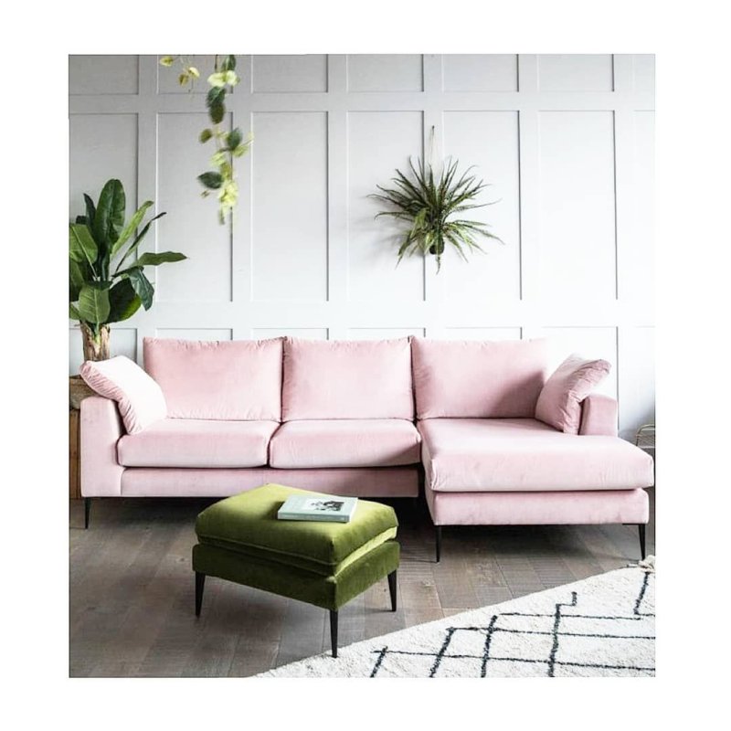 Pink sofa in the interior of the living room