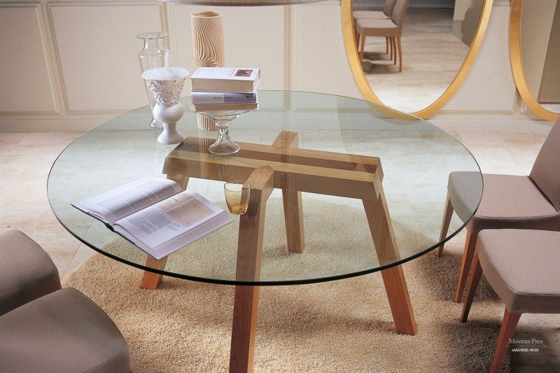 Round glass table in the interior