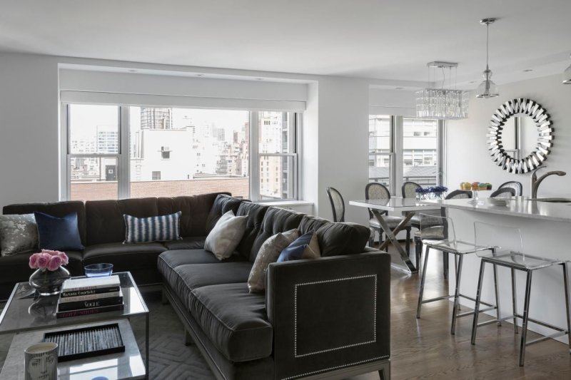 Gray sofa in the interior of the living room