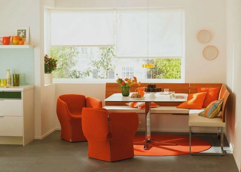 Orange color in the interior of the kitchen