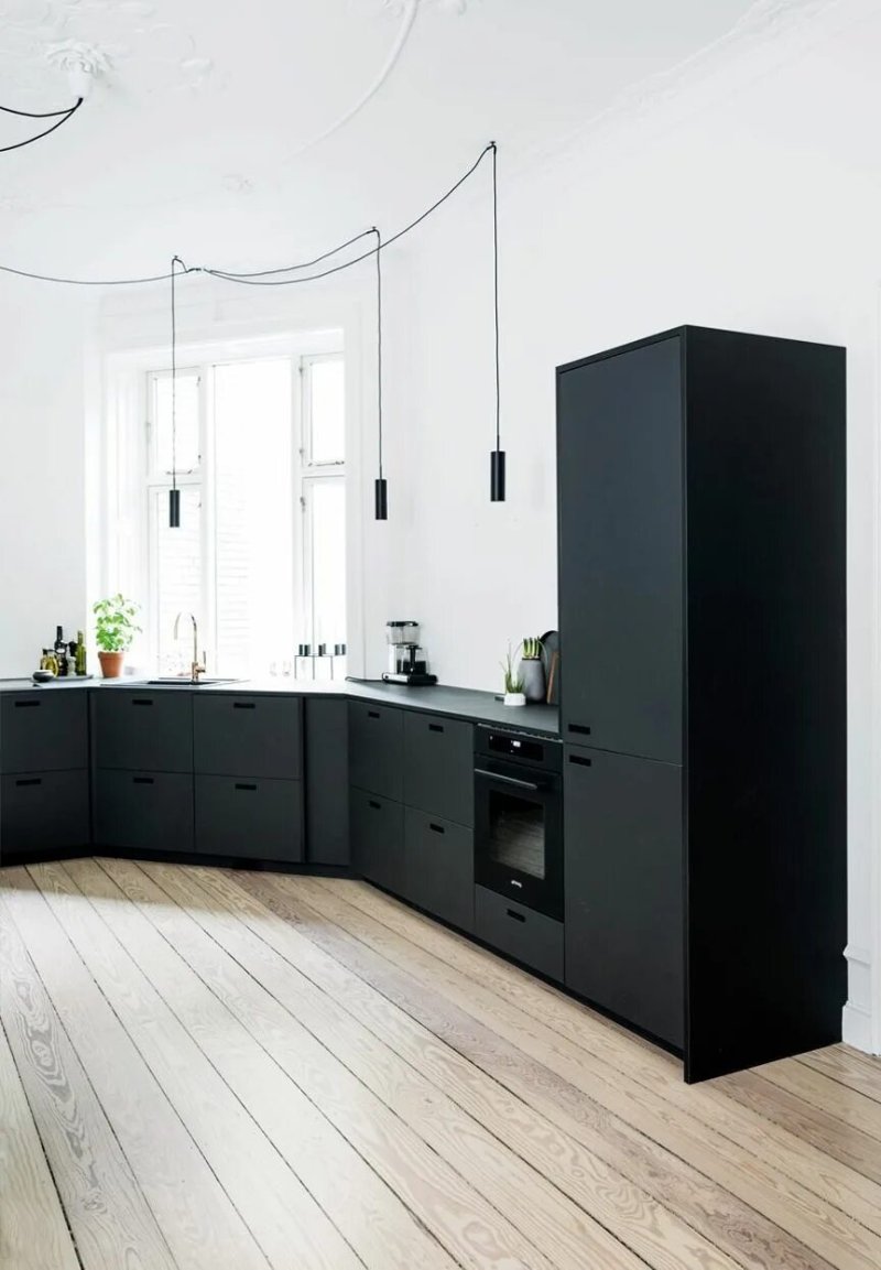 Kitchen with a black refrigerator design