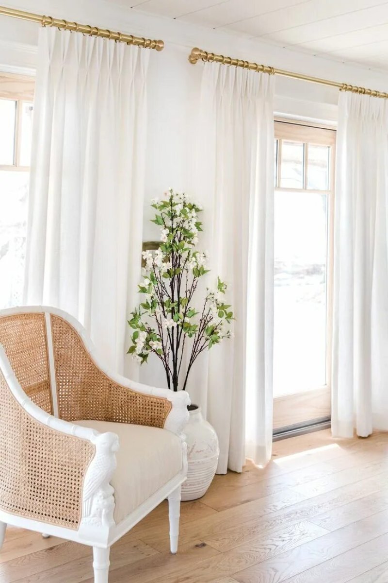 White curtains in the interior of the living room