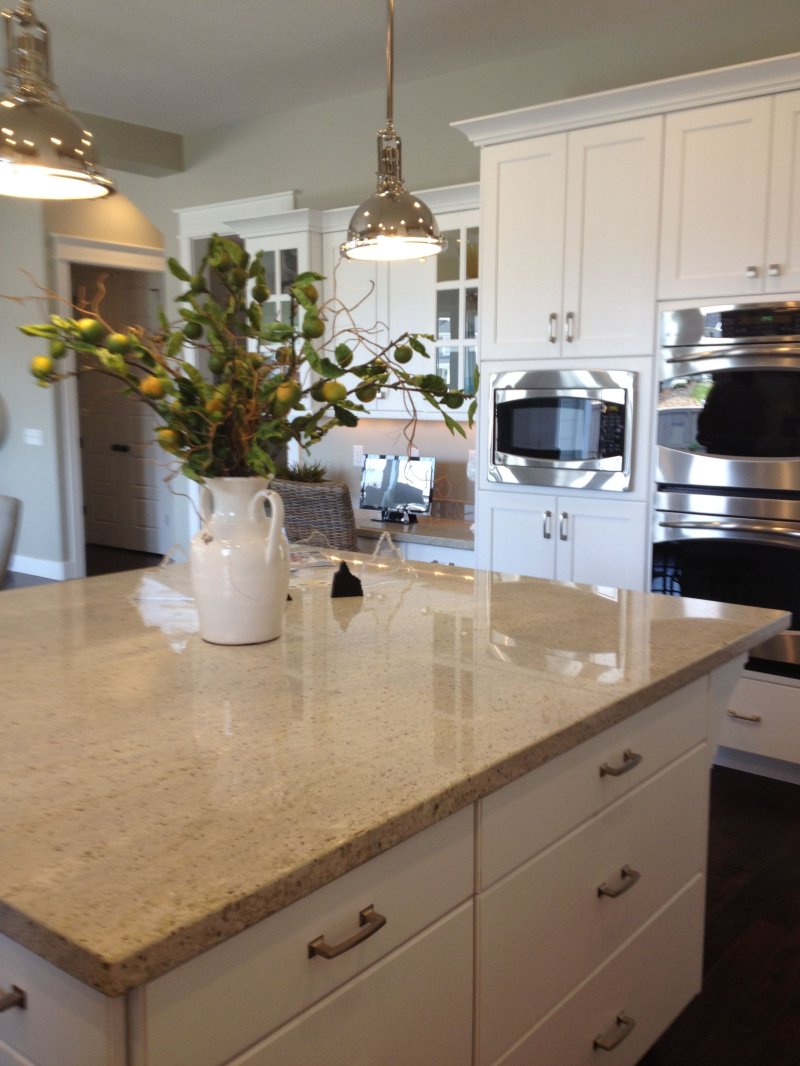 White kitchen with a granite tabletop