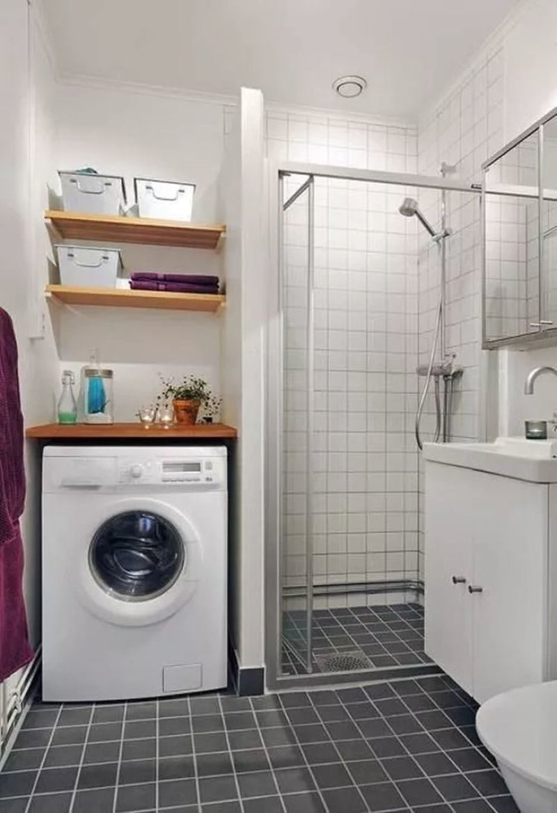 Bathroom with shower and washing machine