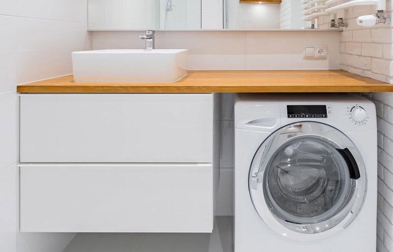 The countertop under the sink and washing machine