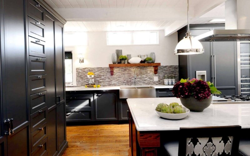 Dark gray kitchen in the interior