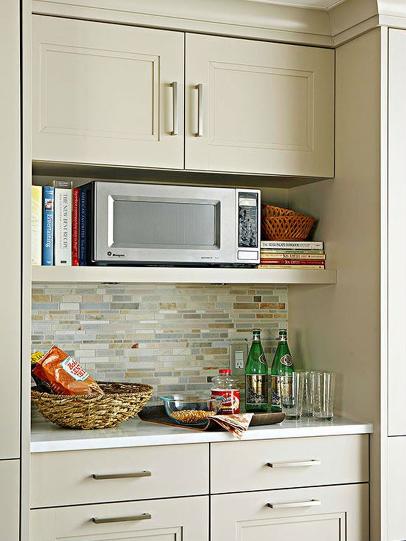 Kitchen with a shelf for microwaves