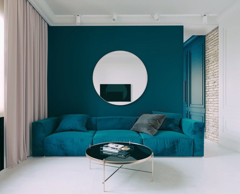 A sofa of the color of the sea wave in the interior