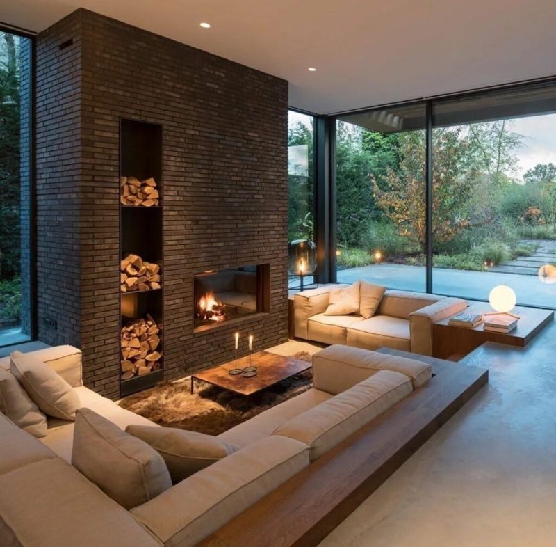 Living room with a fireplace in a modern style in the house