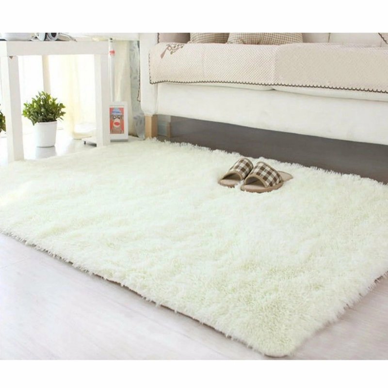 The carpet is white fluffy