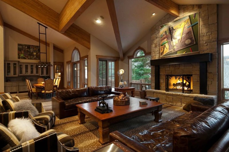 Living room in the style of a chalet with a fireplace