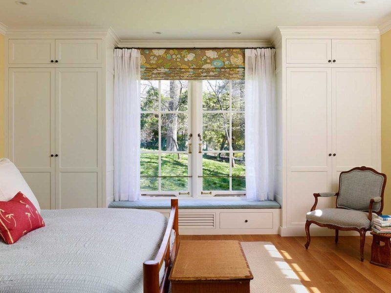 Wardrobe near the window in the bedroom