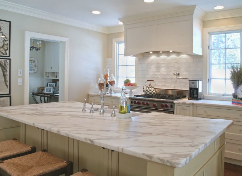 White kitchen with a marble tabletop