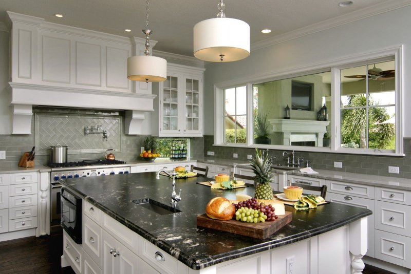 Green kitchen with a marble tabletop