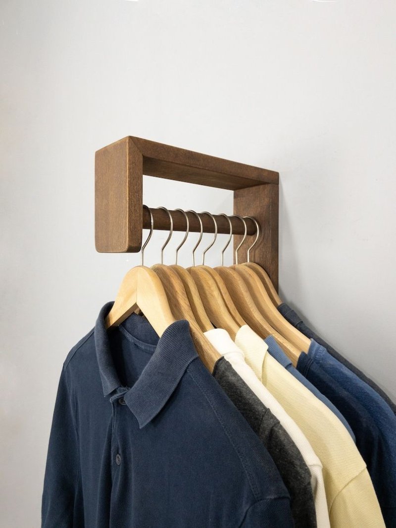 Wooden hanger for clothes