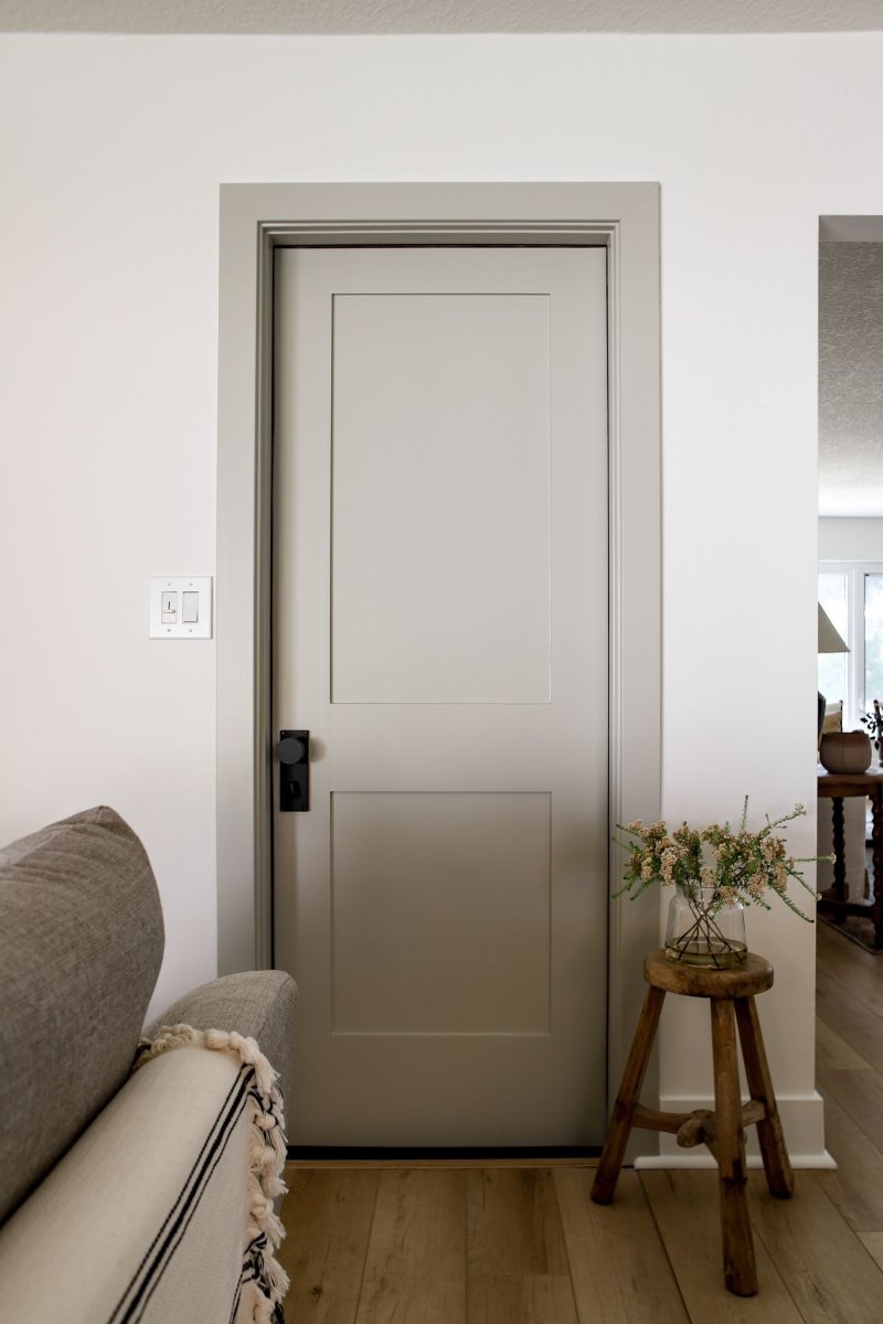 Gray door with white platbands