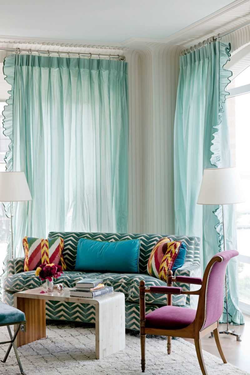 Turquoise curtains in the interior of the living room