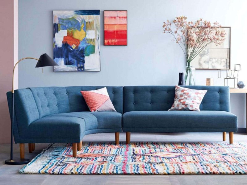 Blue sofa in the interior of the living room