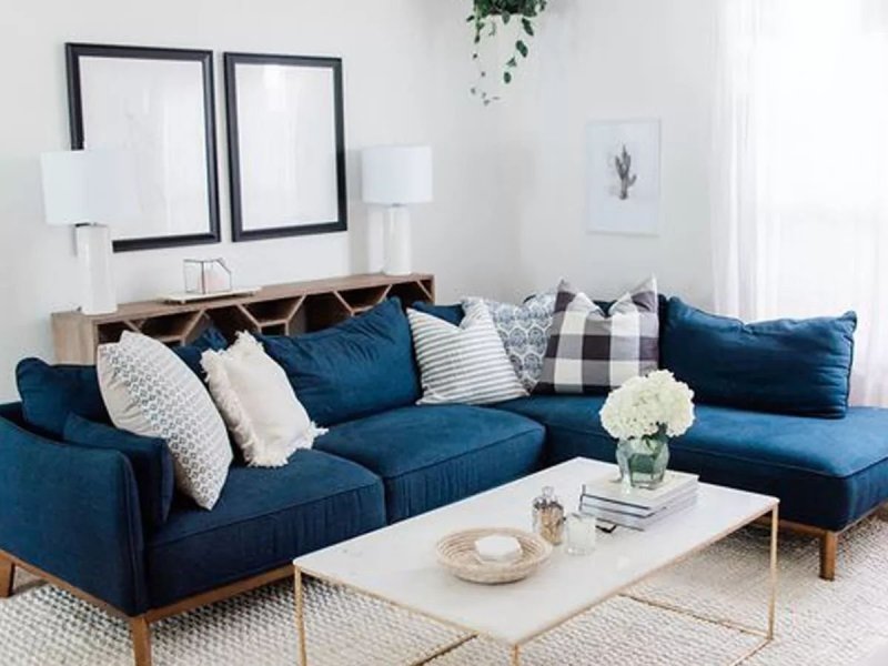 Living room interior with a blue sofa