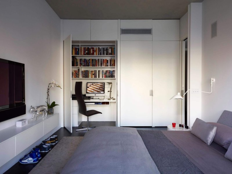 Bedroom with a workplace and a closet