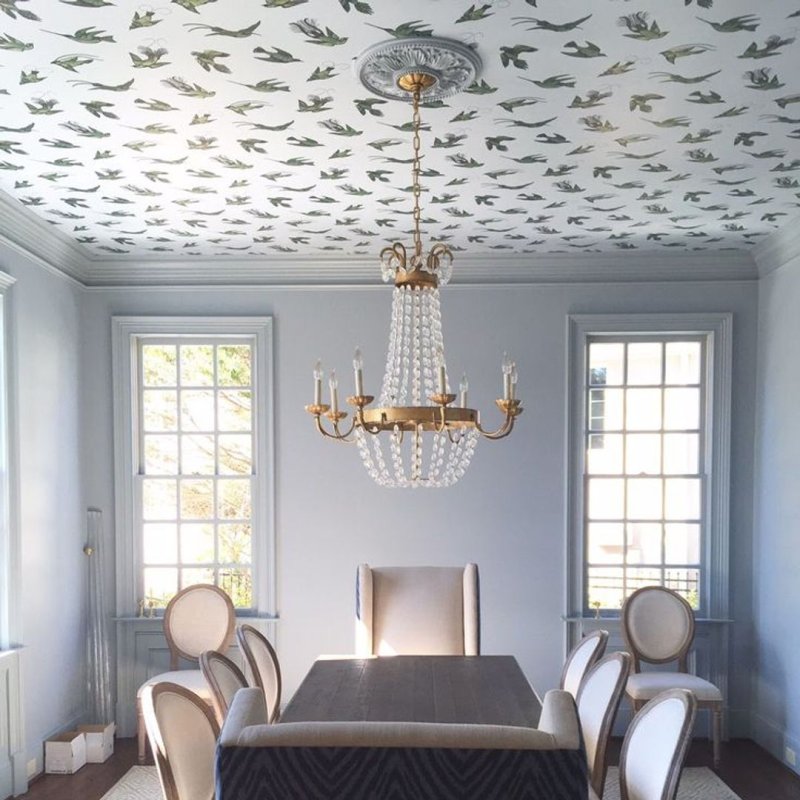 The ceiling covered with wallpaper