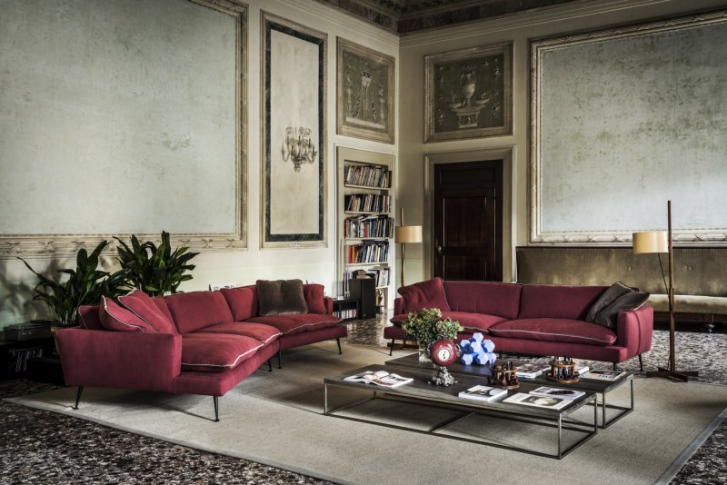 Classic interior with a burgundy sofa in the living room