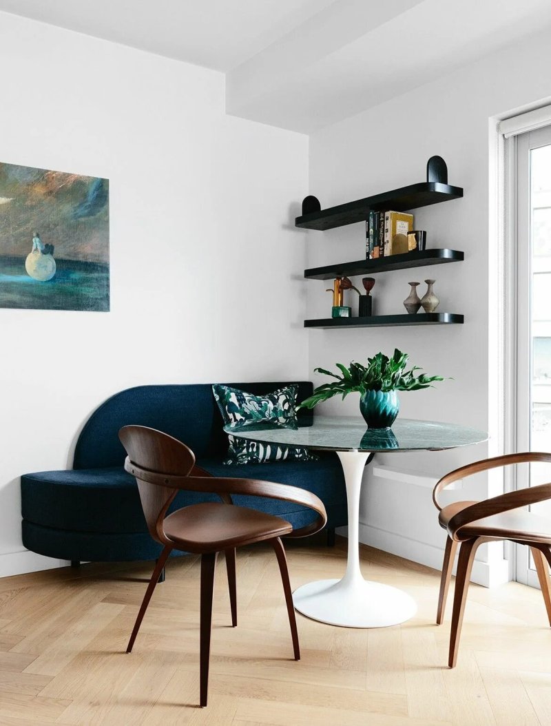 Kitchen with a round table and sofa