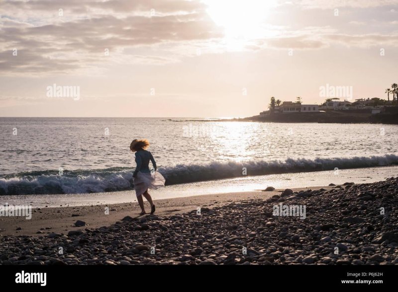 The girl runs on seashore