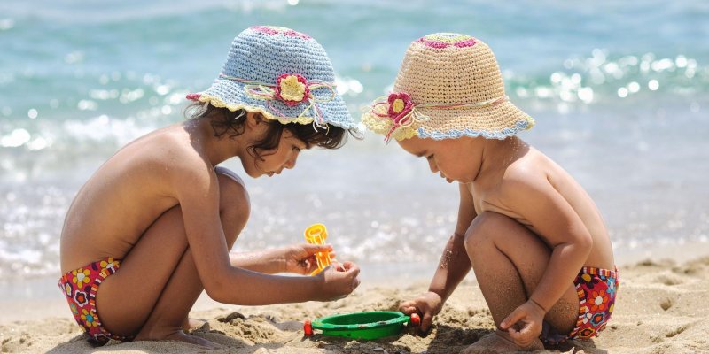 Girls play on the beach
