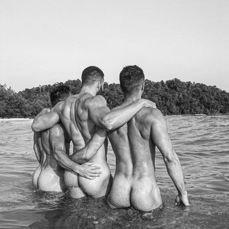 Beautiful naked men on the beach