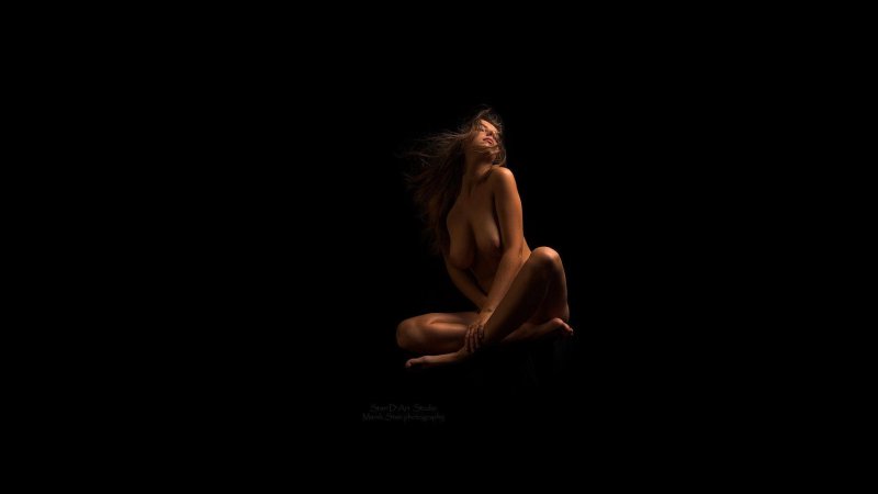 Naked against a carpet background
