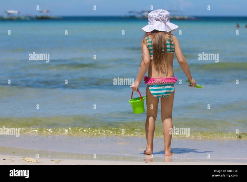 Girls play on the beach